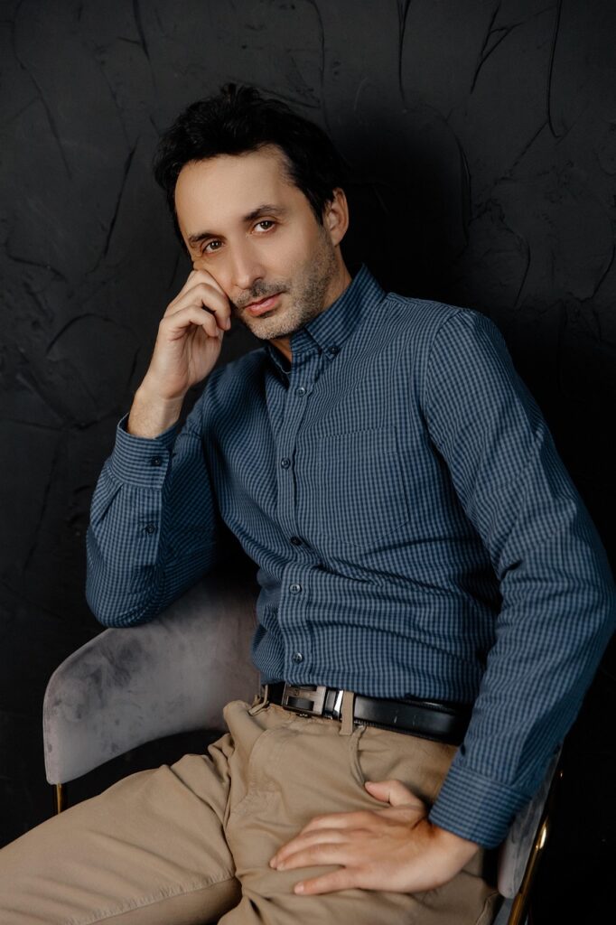 male portrait, man, armchair, sitting, pondered, sight, brunet, classic style, shirt, pants